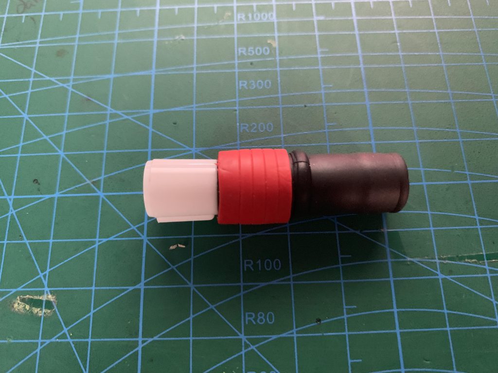 Five-ring Anyball section fitted over the cap