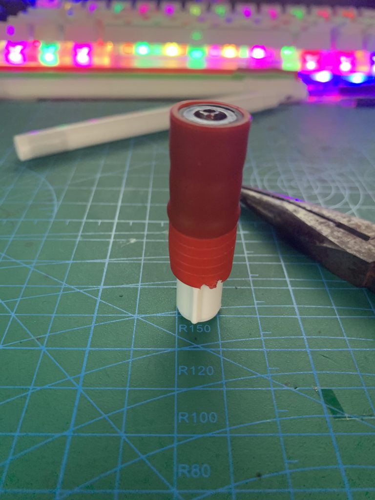 Needlepoint grip fitted over the assembly